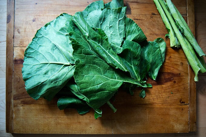 stemmed collard greens on a board