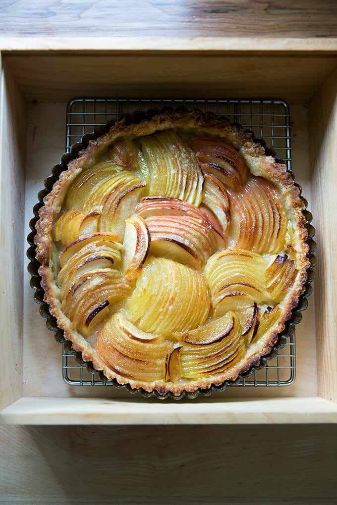 Just baked French apple tart on rack in Pie Box.