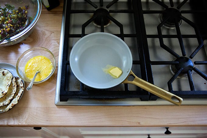 A sauté pan with a dab of butter.