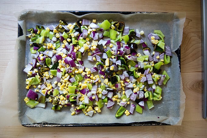 Chopped vegetables on a sheet pan.