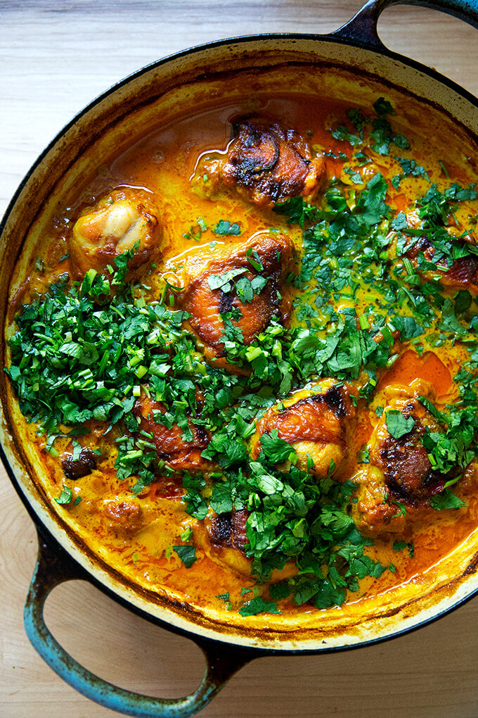 A sauté pan with one-bowl chicken curry and cilantro.