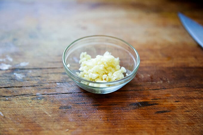 A bowl of minced garlic.