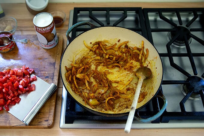A board with sautéed onions and spices.