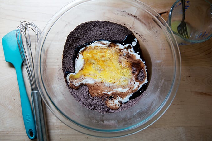 A bowl with ingredients for one-bowl chocolate cupcakes.