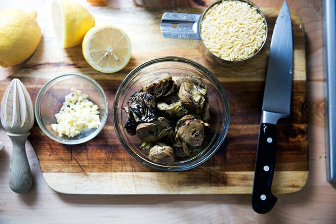 A board with a bowl of Trader Joe's artichoke heats.