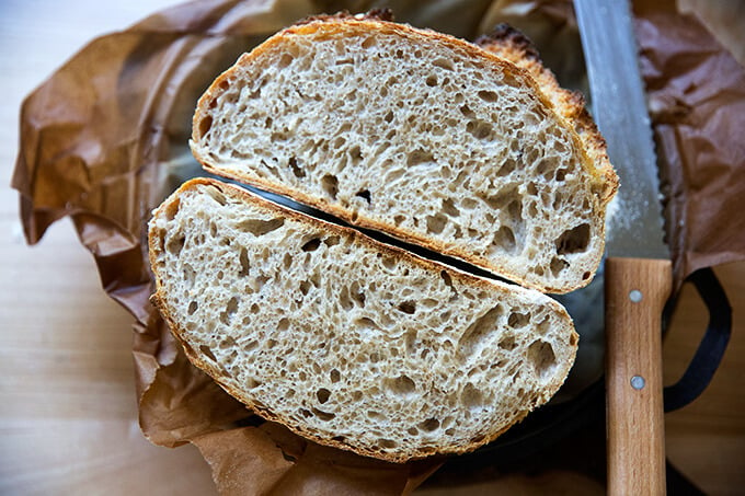 A halved loaf of high hydration sourdough bread.