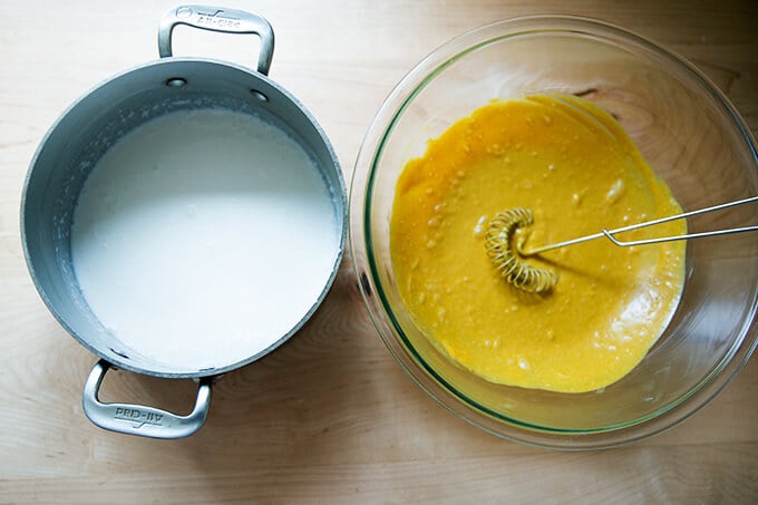 A pot of uncooked coconut rice beside a bowl of easy Thai chicken satay marinade.