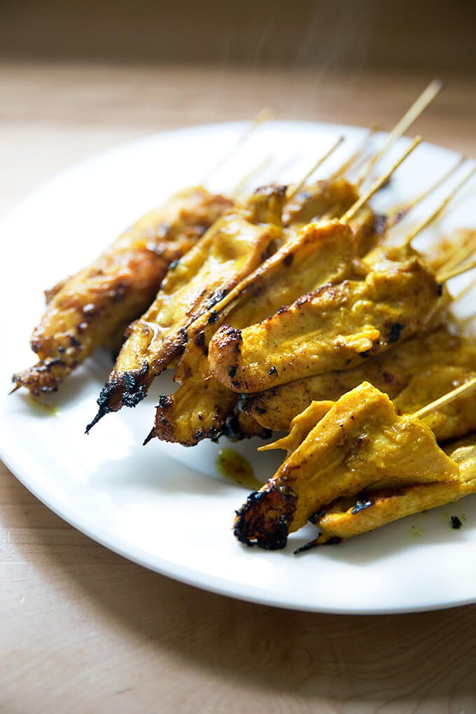 Easy Thai chicken satay skewers on a plate.