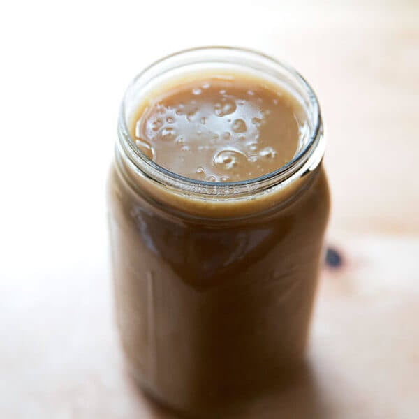 A large Mason jar filled with make-ahead gravy.