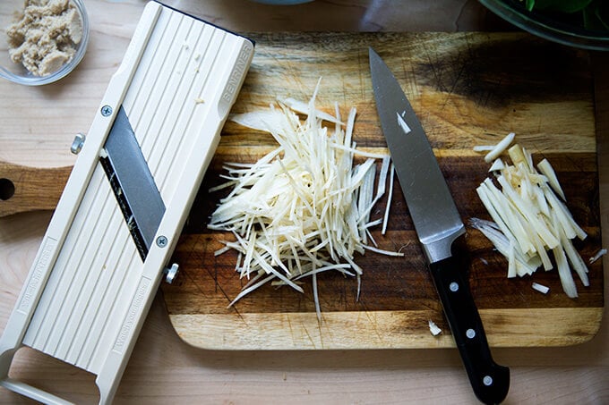 A board with julienned carrots.