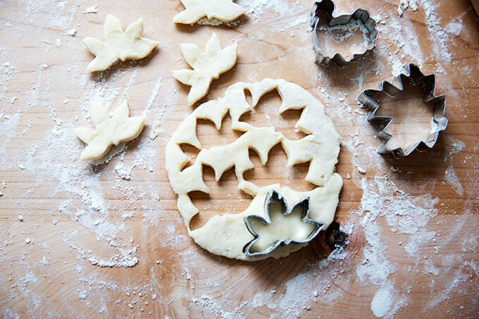 Leftover pie dough rolled out and cut out with leaf and turkey cookie cutters.