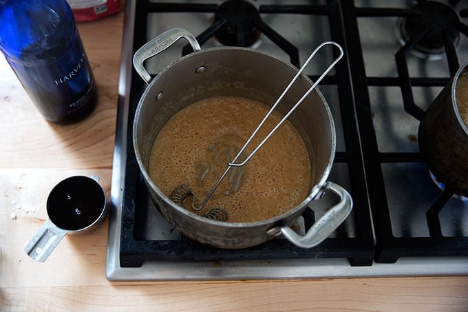 A saucepan filled with a roux browning.