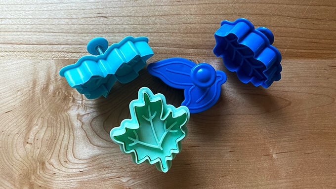A set of stamped leaf cookie cutters.