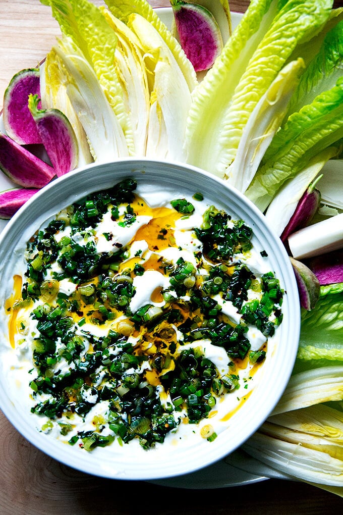 A bowl of homemade ranch dip aside veggies.