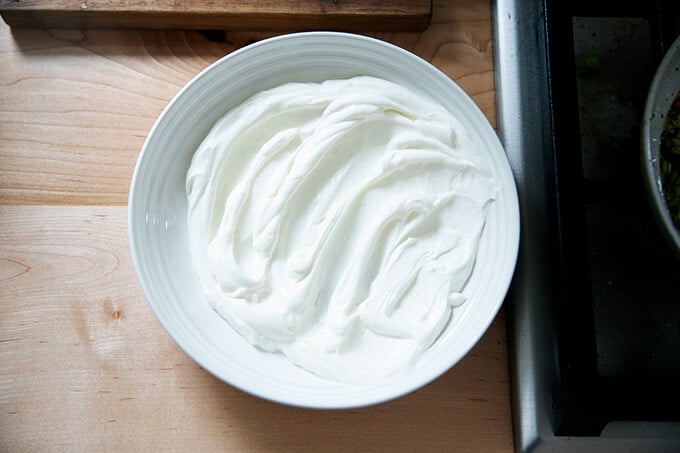 Yogurt swooshes in a bowl.