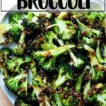 Spicy broiled broccoli with sesame-scallion oil on a plate.