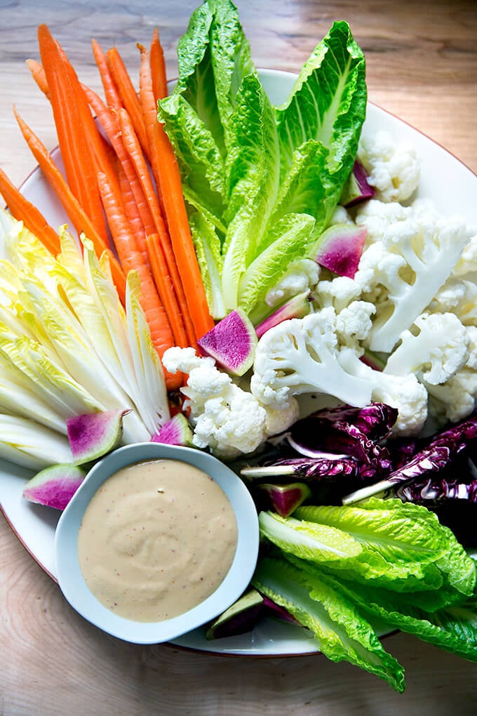 A platter of crudités with spicy cashew dip.