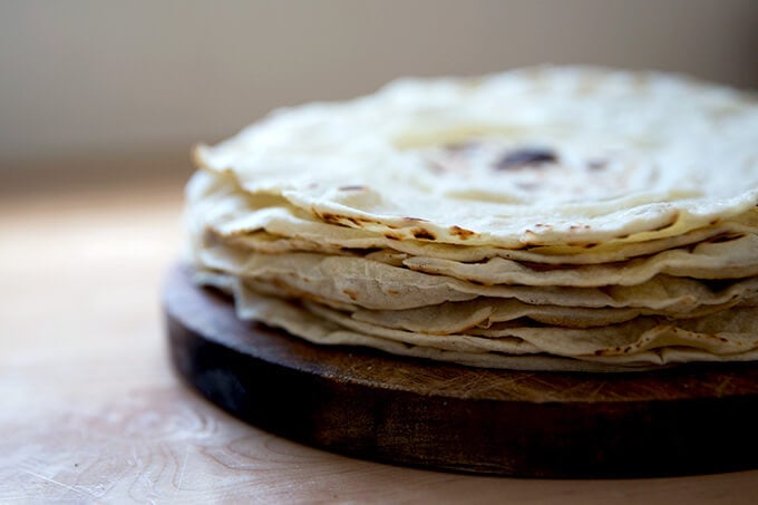 A stack of homemade flour tortillas.