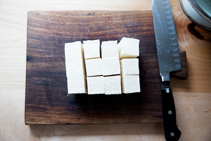 A block of tofu cut into cubes.