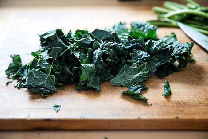 Kale, chopped, on a cutting board.