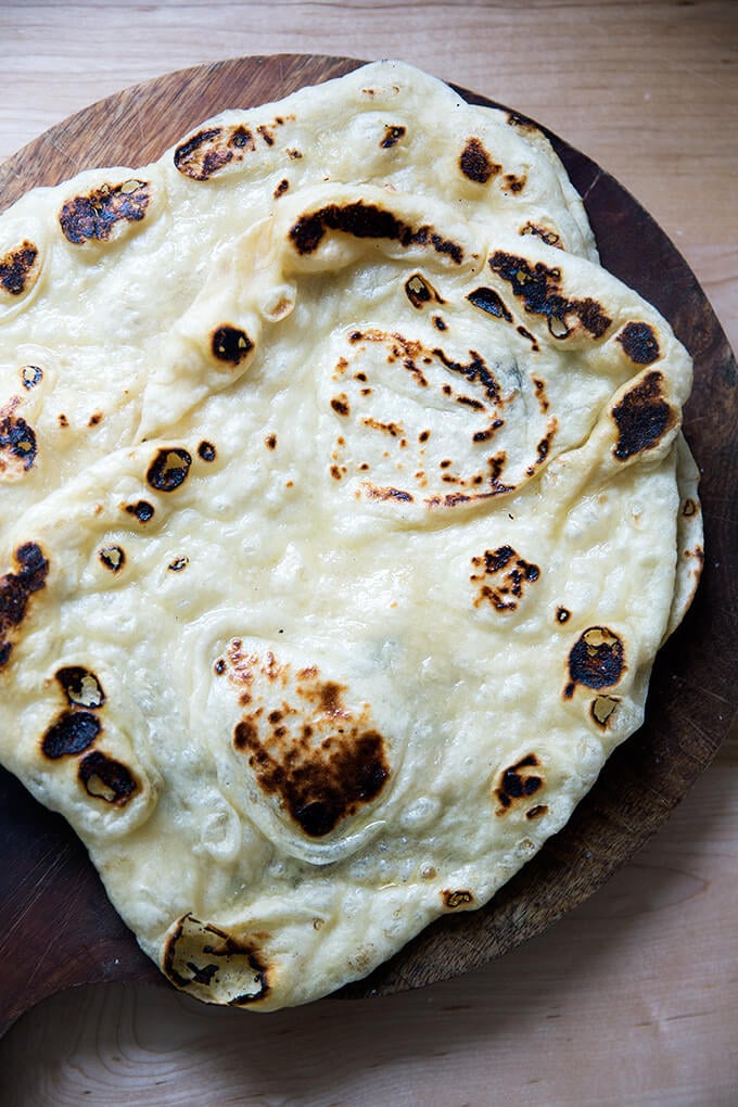 Fresh naan on a board.