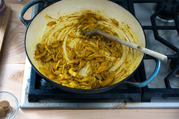 Onions, sautéing stovetop with curry spices.