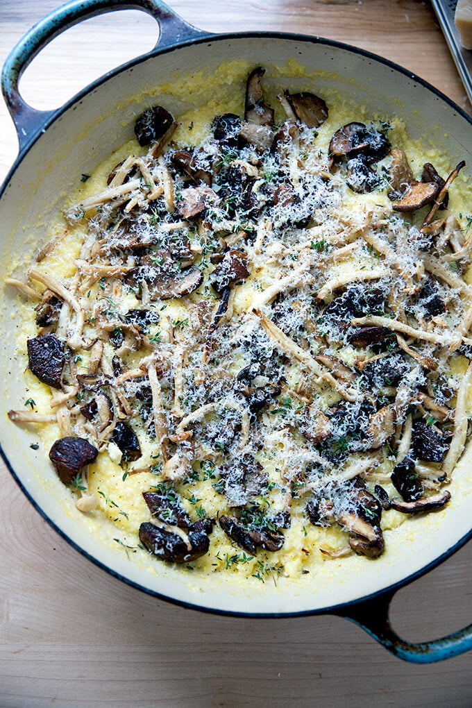 An overhead shot of a skillet of roasted mushroom polenta bake just out of the oven.