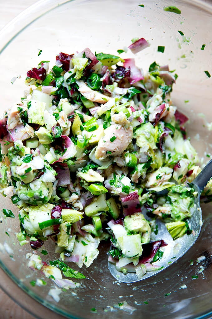 A bowl of smoked trout and avocado salad.