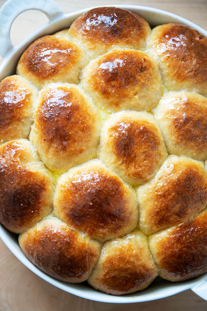 Buttered hot cross buns in pan.