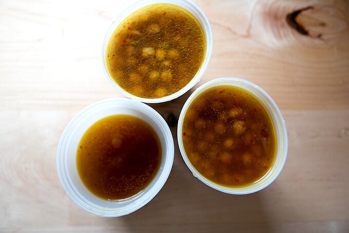 Overhead shot of quart containers of cooked chickpeas.