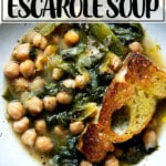 A bowl of chickpea and escarole soup with toasty bread.