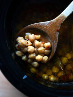 A spoonful of cooked slow cooker chickpeas.