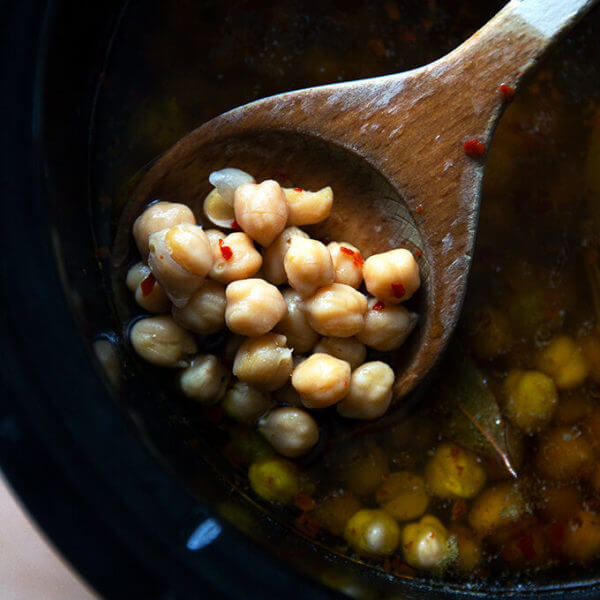 A spoonful of cooked slow cooker chickpeas.