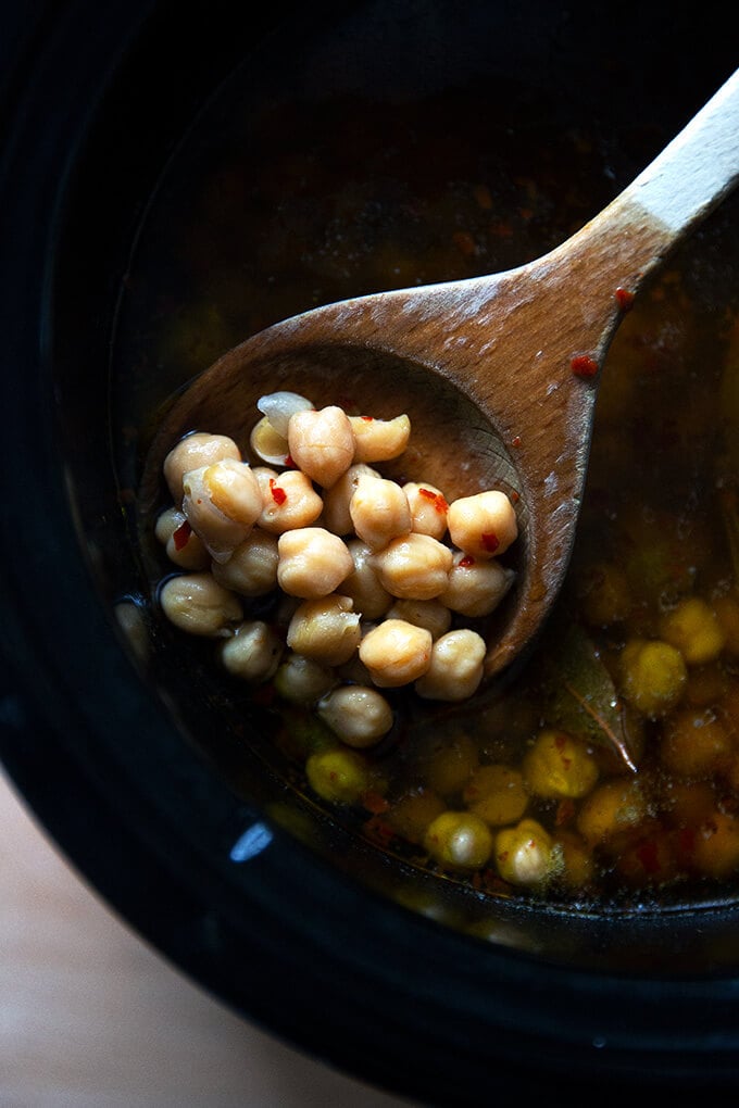 A spoonful of cooked slow cooker chickpeas.