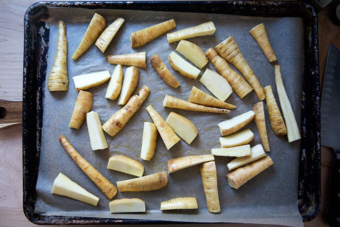 A sheet pan with un-roasted parsnips.