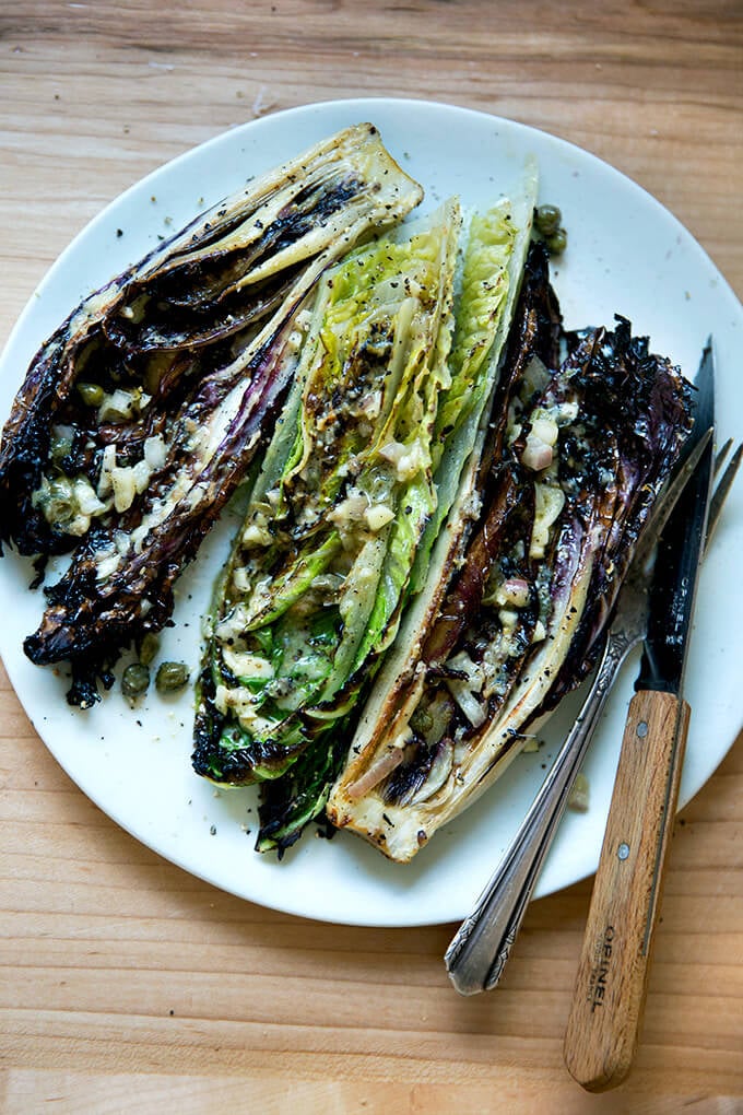 A plate of grilled Romaine salad.