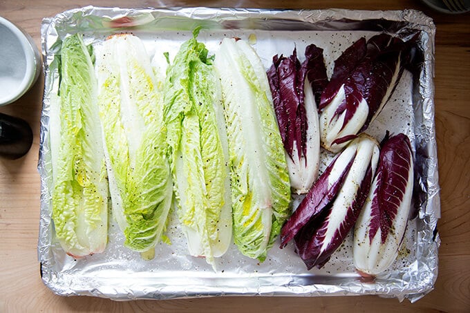 A sheet pan of Romaine and Trevsio ready to be broiled.