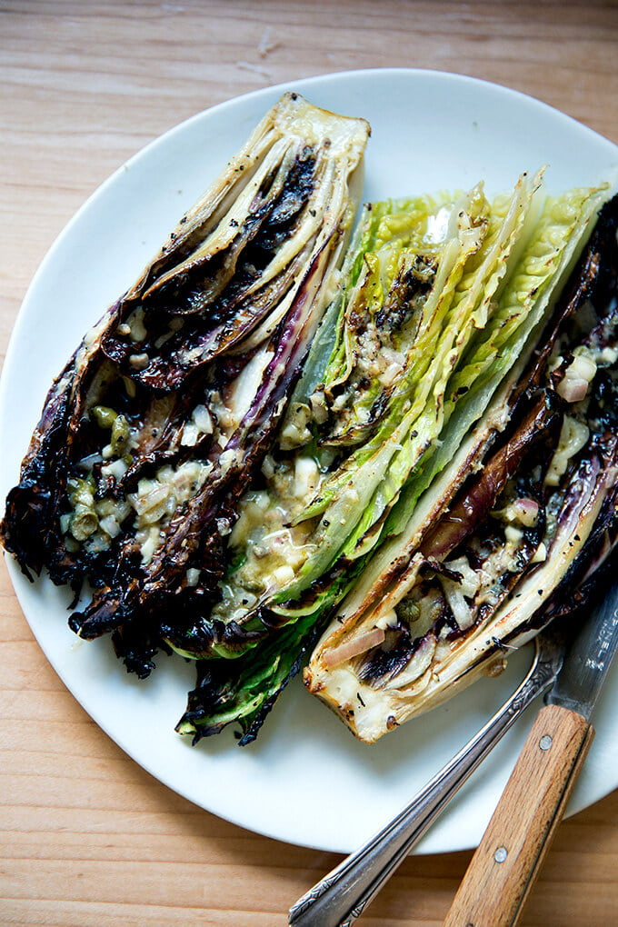 A plate of "grilled" Romaine salad with anchovy dressing.