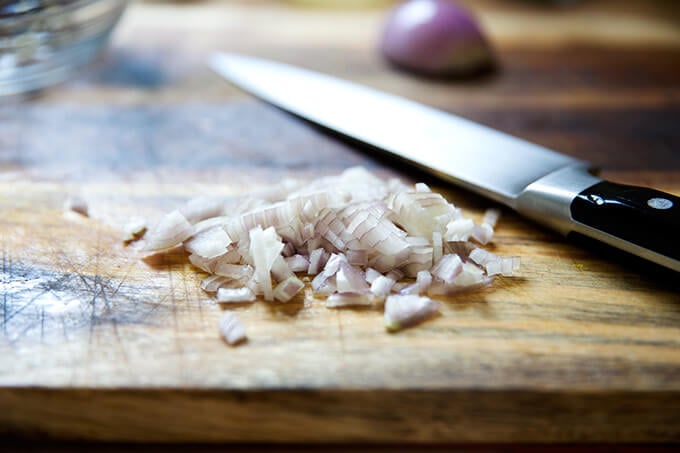 Minced shallots on a board.