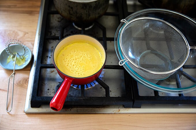 Mustard sauce simmering stovetop.