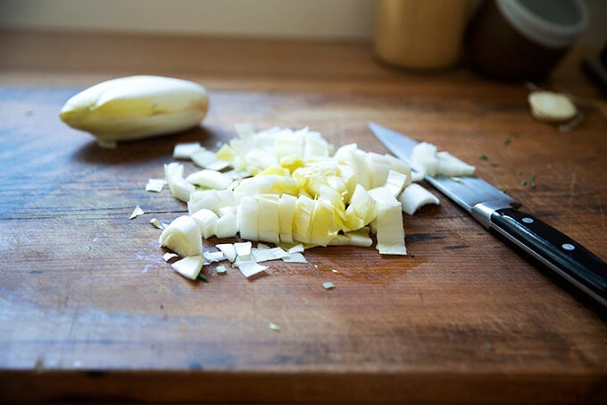 Chopped Endive on a cutting board.