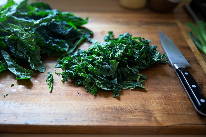 Chopped kale on a board.