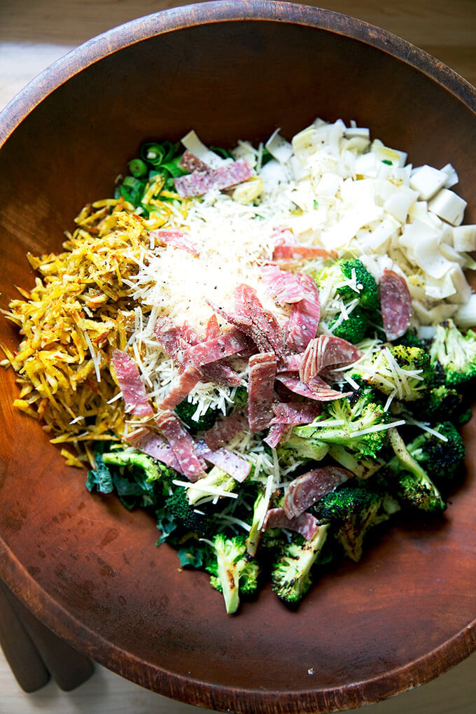 A large salad bowl filled with the ingredients for a chopped salad.