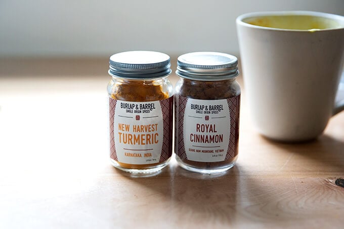 Two jars of Burlap and Barrel spices: turmeric and cinnamon. 