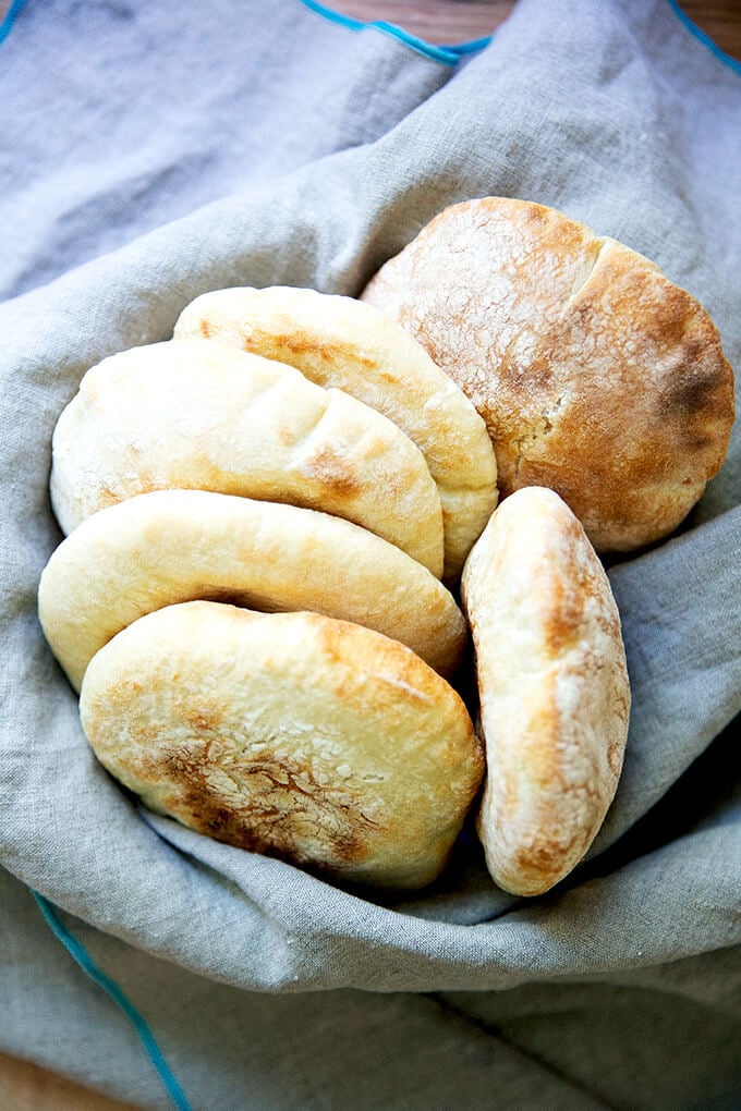 A bowl of freshly baked pita bread.
