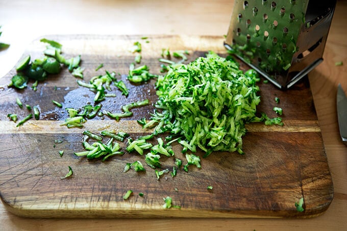 Grated cucumber on a board.