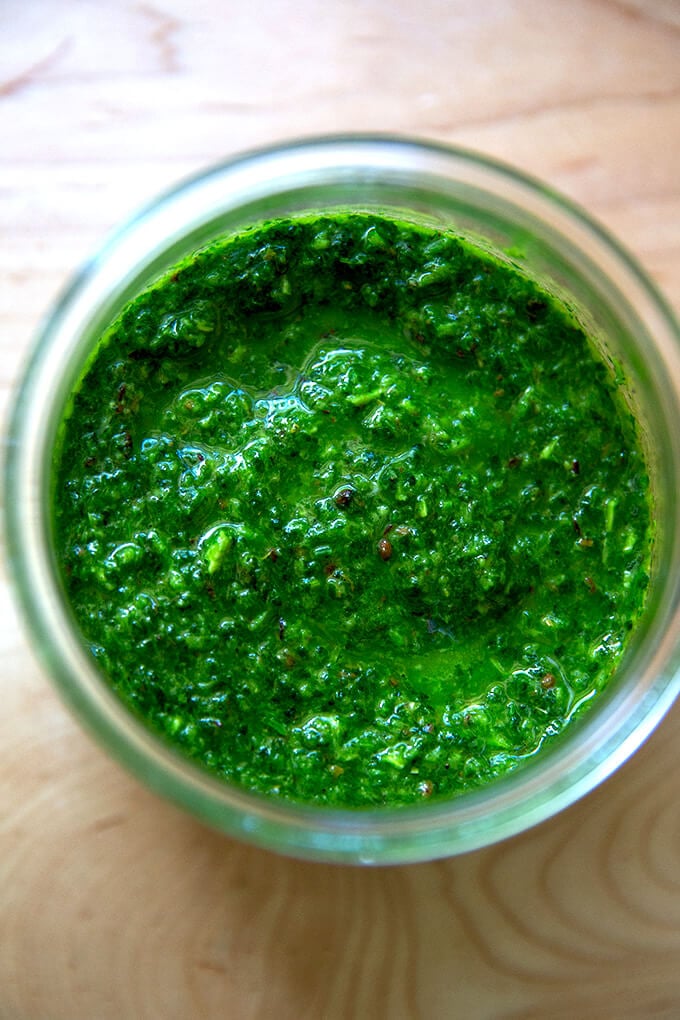 A jar of schug, an herby, spiced condiment.