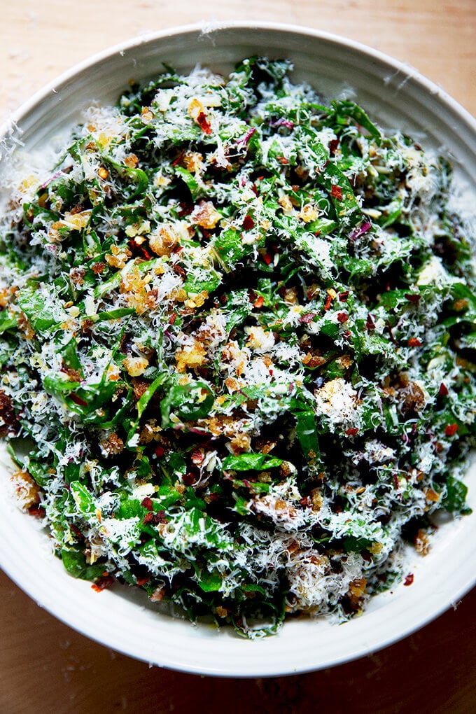 A plate of Swiss chard salad with parmesan and bread crumbs. 