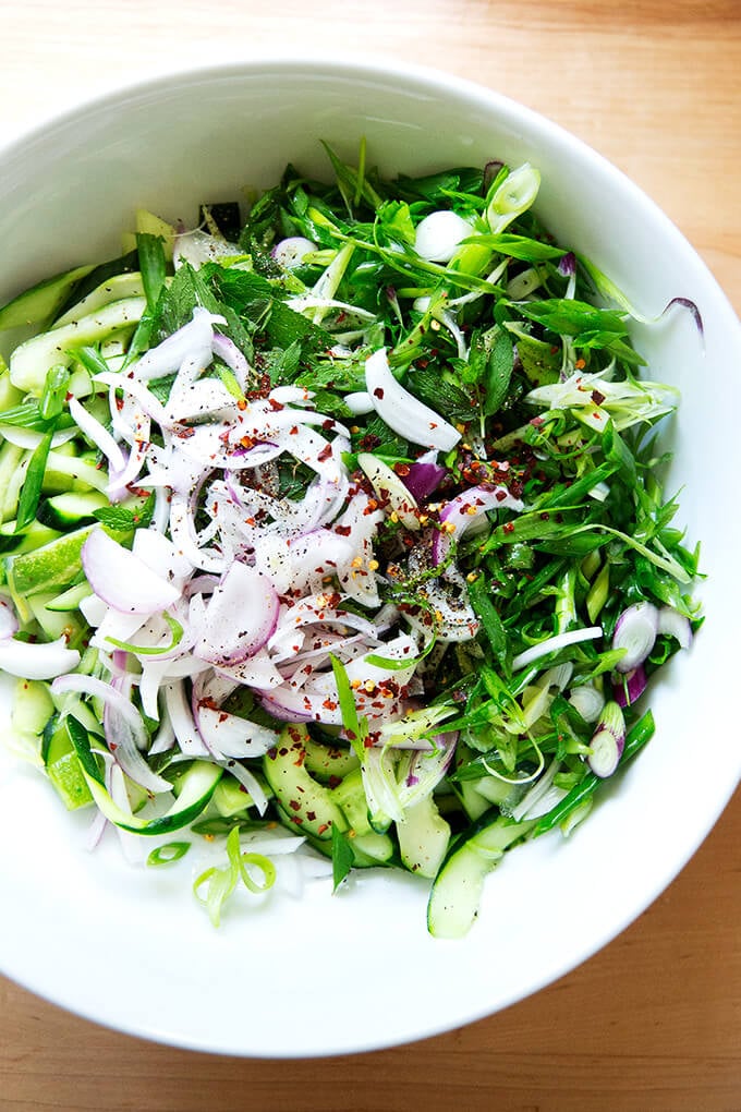 Untossed cucumber salad in bowl.