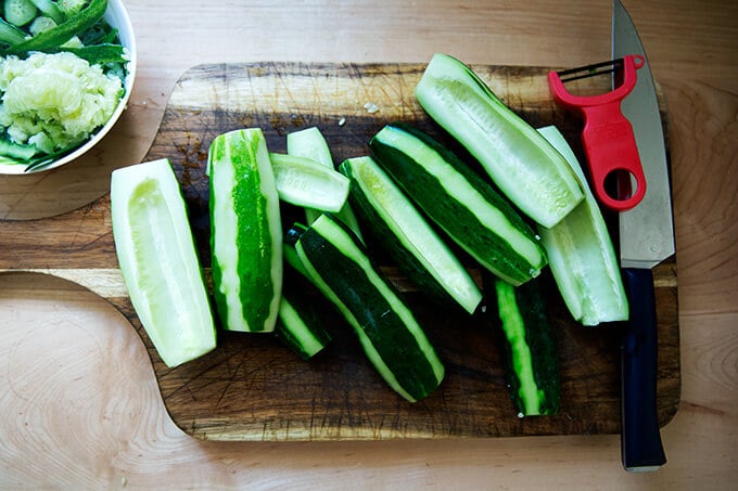 Peeled cucumbers on board.